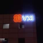 Making a Bold Statement with M&G Global Ads: High-Quality Outdoor Building Signs for VXI Global