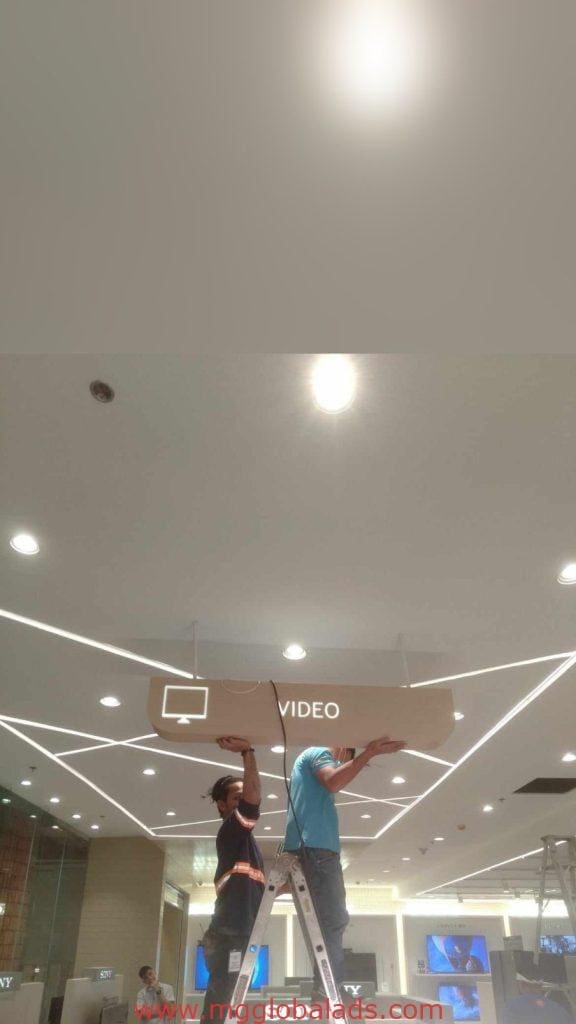 Acrylic indoor signage installation labeled VIDEO in a modern Ortigas building, geometric lights—by M&G Global Ads.