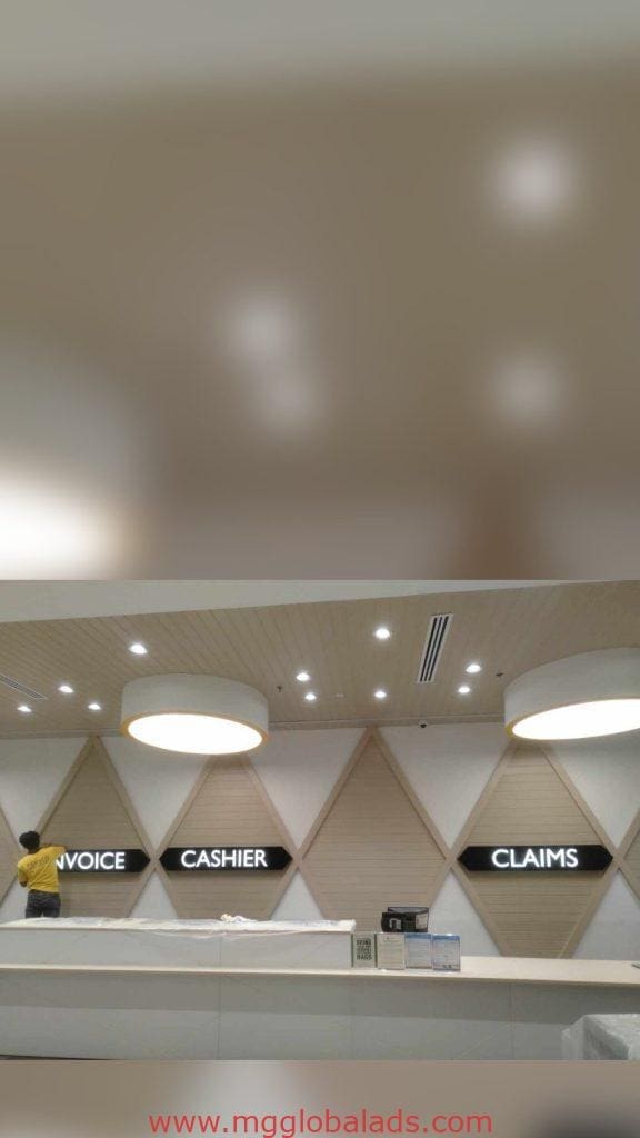 Metal indoor office signage install for cashier & claims area, modern wall, Mandaluyong. By M&G Global Ads.