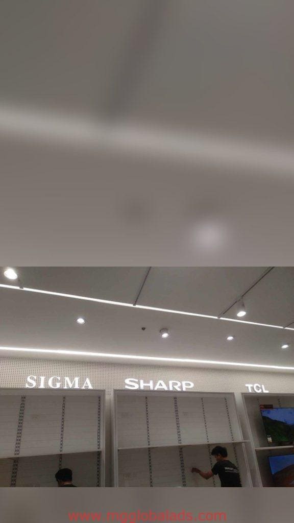 Acrylic signage for SIGMA, SHARP, TCL retail shelves in Makati store, modern ceiling design. By M&G Global Ads.