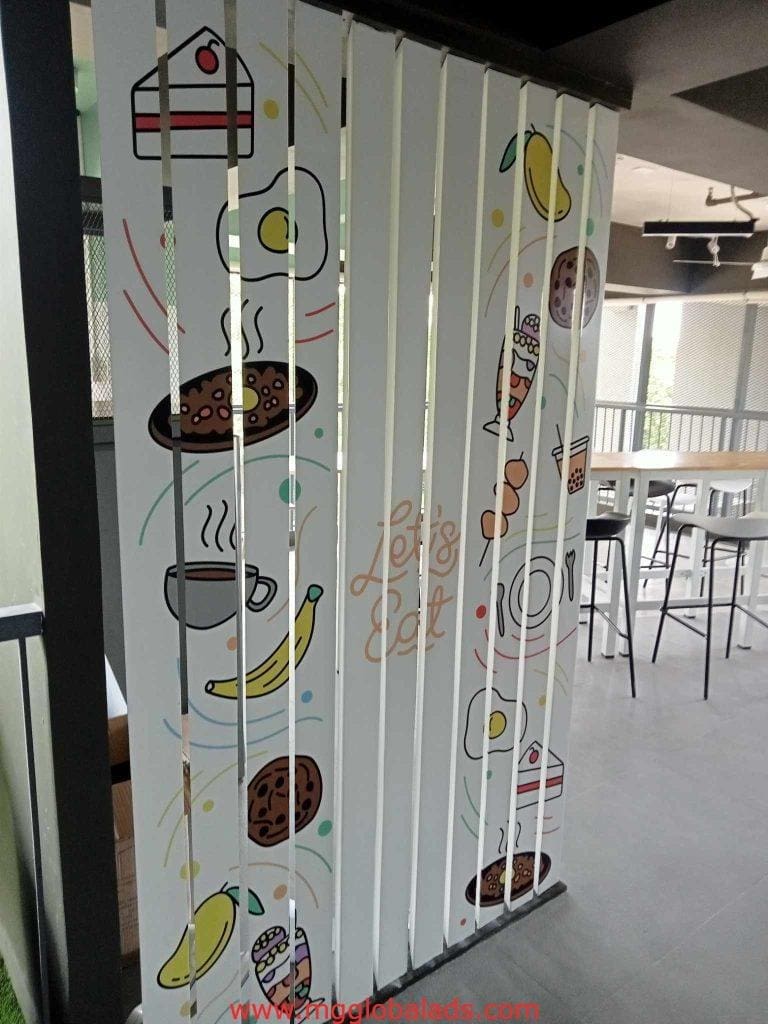 Acrylic signage partition with food art and Lets Eat for restaurant dining area in Makati by M&G Global Ads.