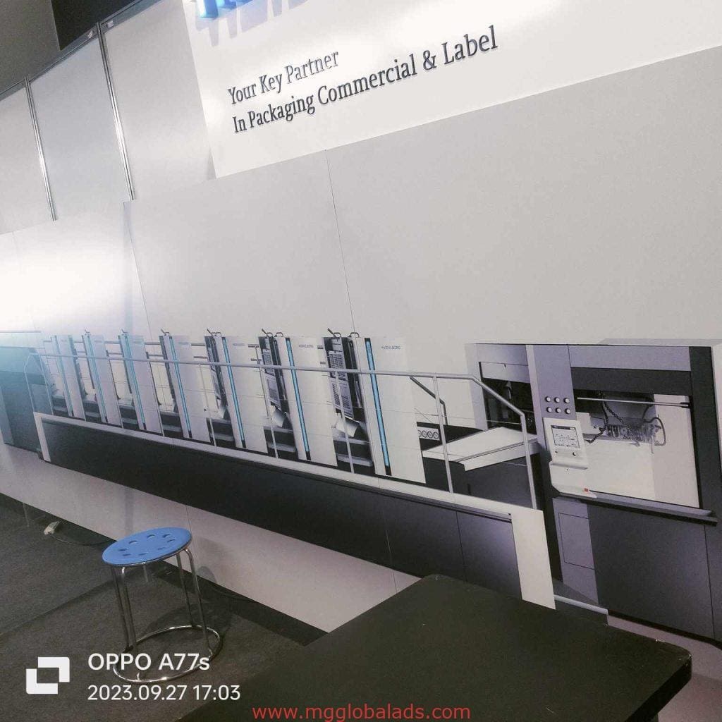 Acrylic signage for industrial packaging at commercial facility in Ortigas, with stool and gray floor, by M&G Global Ads.