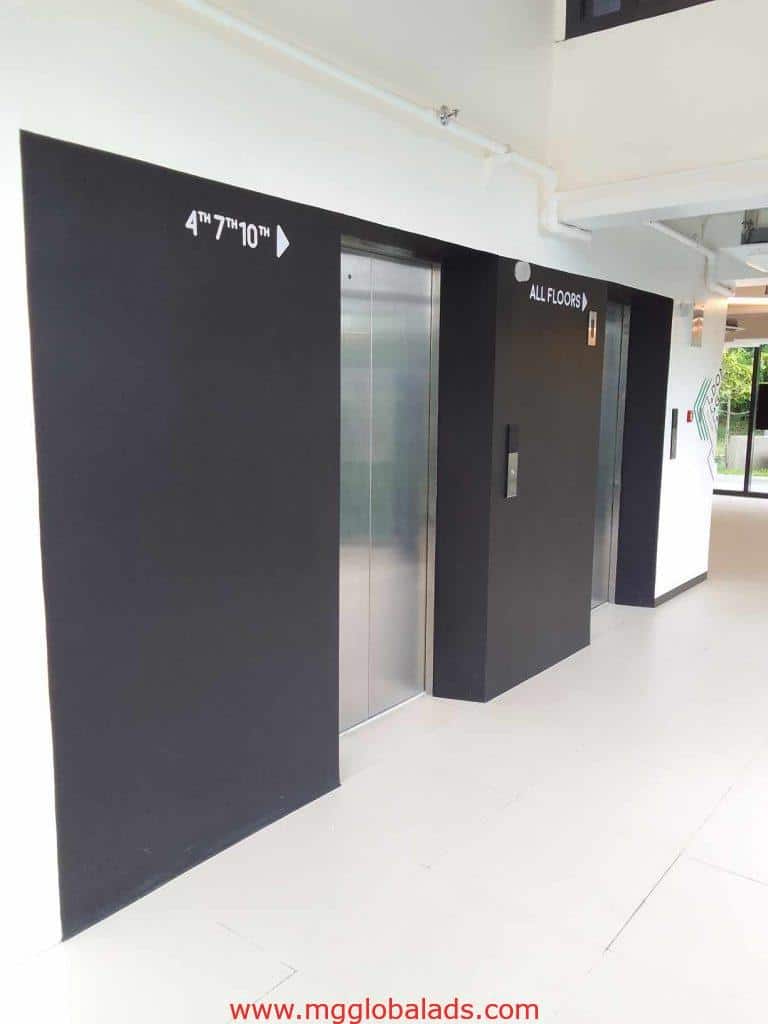Elevator LED signage with floor numbers and arrows in a modern Mandaluyong building by M&G Global Ads.