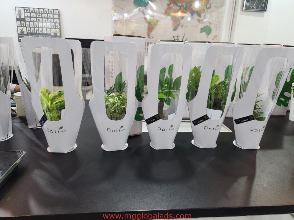 Opti featuring small green plants and boxes in Mandaluyong, by M&G Global Ads.