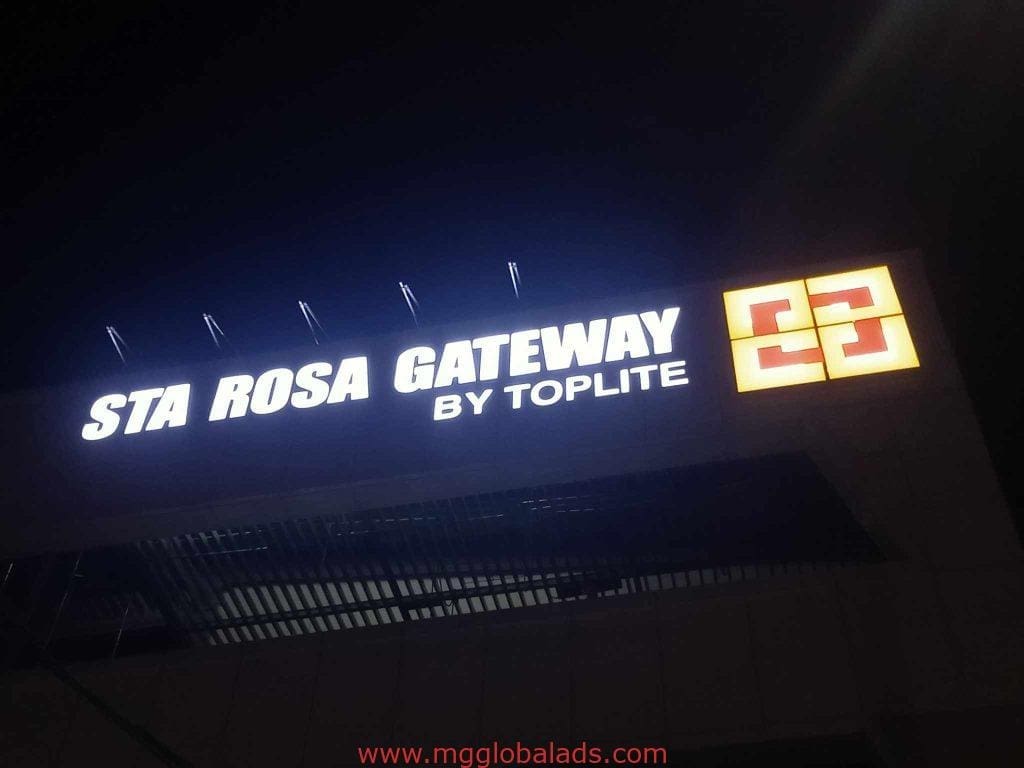 Illuminated acrylic signage for STA ROSA GATEWAY BY TOPLITE, yellow and red logo, facade display in Makati by M&G Global Ads.