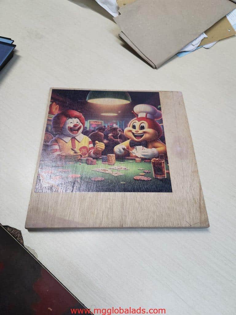 Metal indoor signage for McDonalds in Makati, shows Ronald McDonald & Jollibee playing poker. by M&G Global Ads.