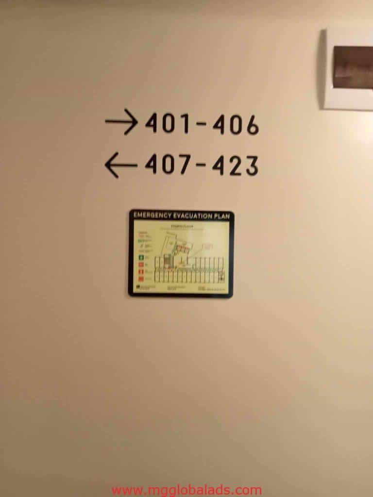 Directional room number wayfinding signage and emergency evacuation map in Makati by M&G Global Ads.