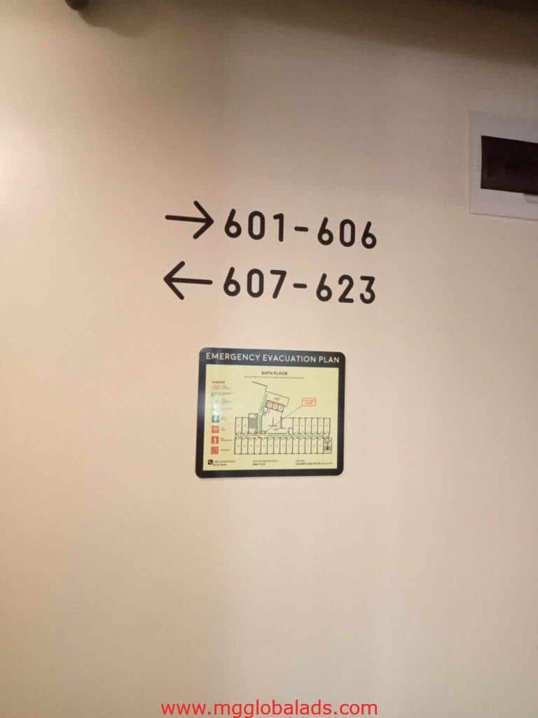 Acrylic directional signage and emergency evacuation plan in Makati, arrows to rooms 601–623, by M&G Global Ads.