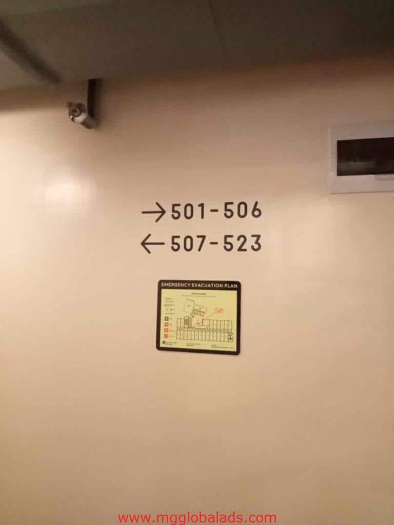 Directional wayfinding sign with emergency plan in Makati hotel corridor, metallic finish, by M&G Global Ads.