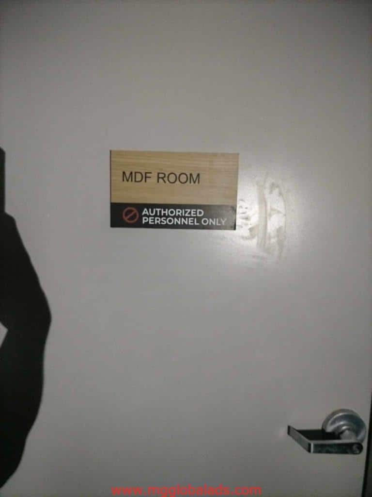 Acrylic and metallic door signage for MDF ROOM and AUTHORIZED PERSONNEL ONLY in Makati, no-entry symbol visible, by M&G Global Ads.