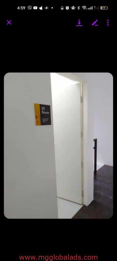 Acrylic room signage for EE Room with smaller text, white door and walls in Makati office. By M&G Global Ads.