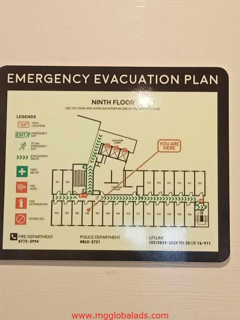 Ninth floor emergency evacuation signage for offices in Makati, showing exits, stairs, and contacts. By M&G Global Ads.