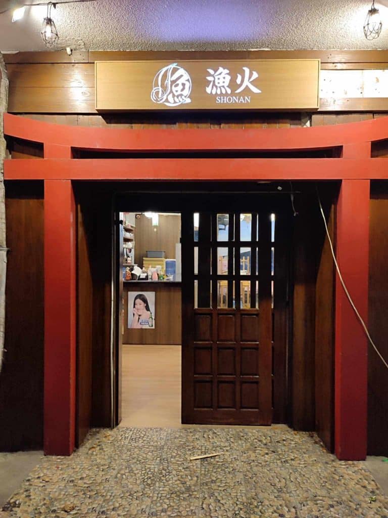 Shonan LED signage for Japanese restaurant entrance with red torii gate and wooden door in BGC by M&G Global Ads.