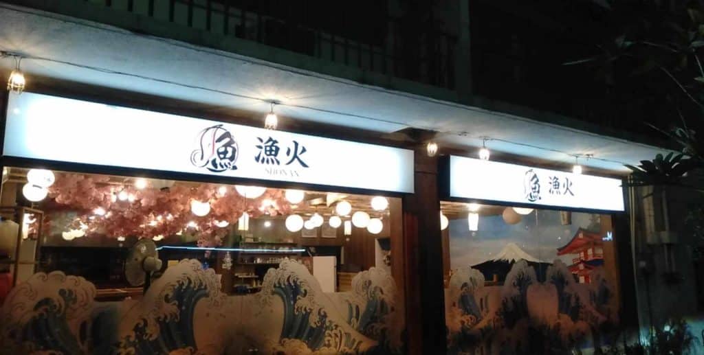 Illuminated Japanese restaurant signage with lanterns in Quezon City, wave & Mt. Fuji window art by M&G Global Ads.