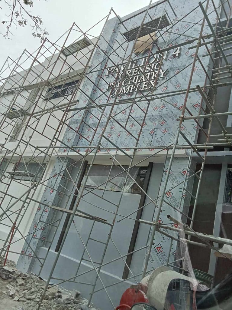 LED signage for 24/7 EMERGENCY PSYCHIATRY COMPLEX at a construction site in Quezon City by M&G Global Ads.