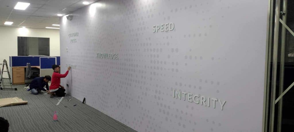 Raised office wall signage installation with words KNOWLEDGE and INTEGRITY in a bright Mandaluyong workspace by M&G Global Ads.