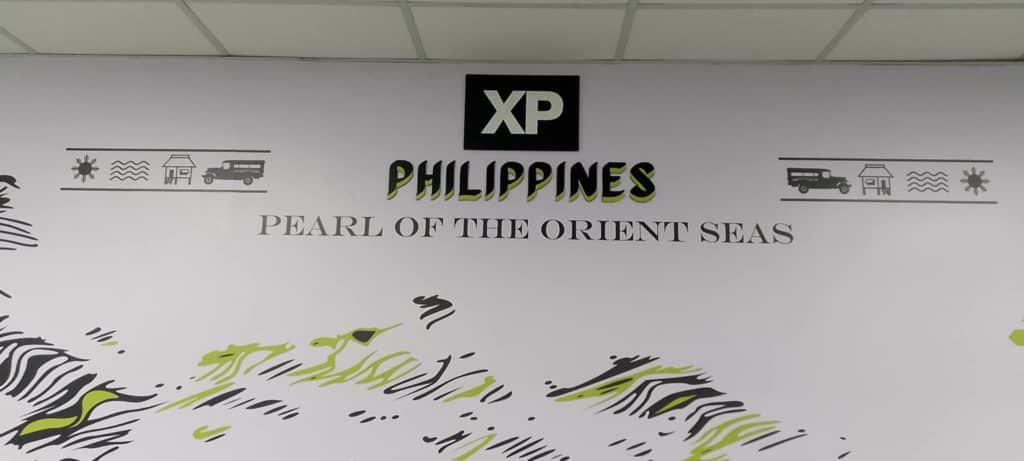 Metallic office signage for XP Philippines, Pearl of the Orient Seas in Ortigas with icons and patterns by M&G Global Ads.
