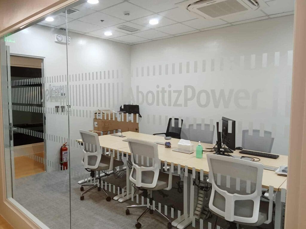 frosted sticker office signage for AboitizPower in a modern meeting room, Mandaluyong location by M&G Global Ads.