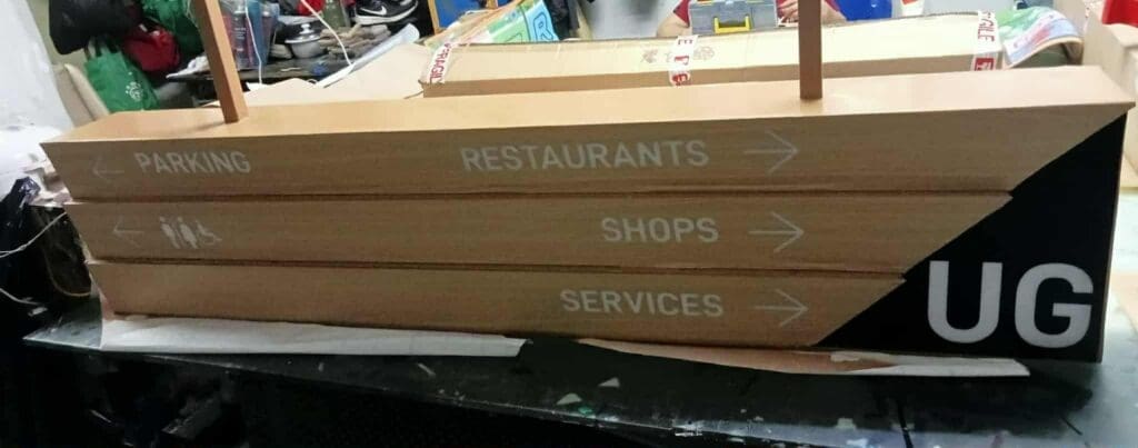 Indoor wooden wayfinding directional sign for PARKING, RESTAURANTS, SHOPS, SERVICES by sign maker Philippines by M&G Global Ads.