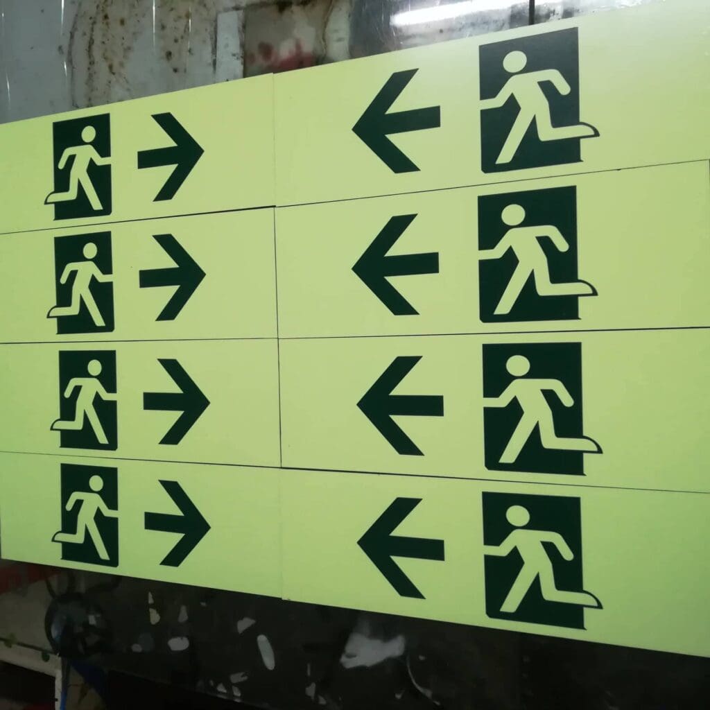 Acrylic emergency exit signs with running figure, wayfinding signage in Metro Manila by sign maker Philippines, by M&G Global Ads.