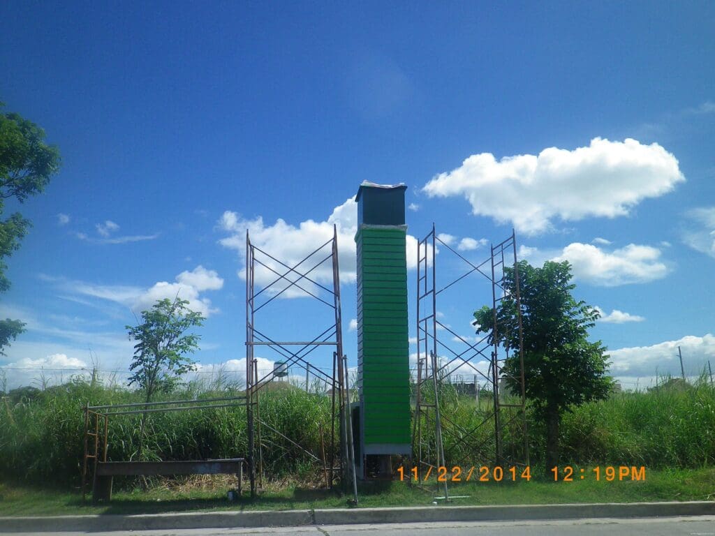 Outdoor pylon sign, green structure, roadside in Philippines, by sign maker Philippines M&G Global Ads.