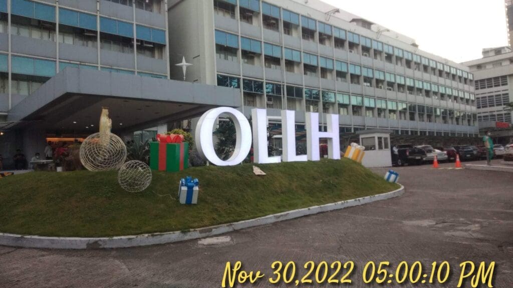 Outdoor acrylic signage OLLH with Christmas decor, multi-story building, Metro Manila, sign maker Philippines by M&G Global Ads.