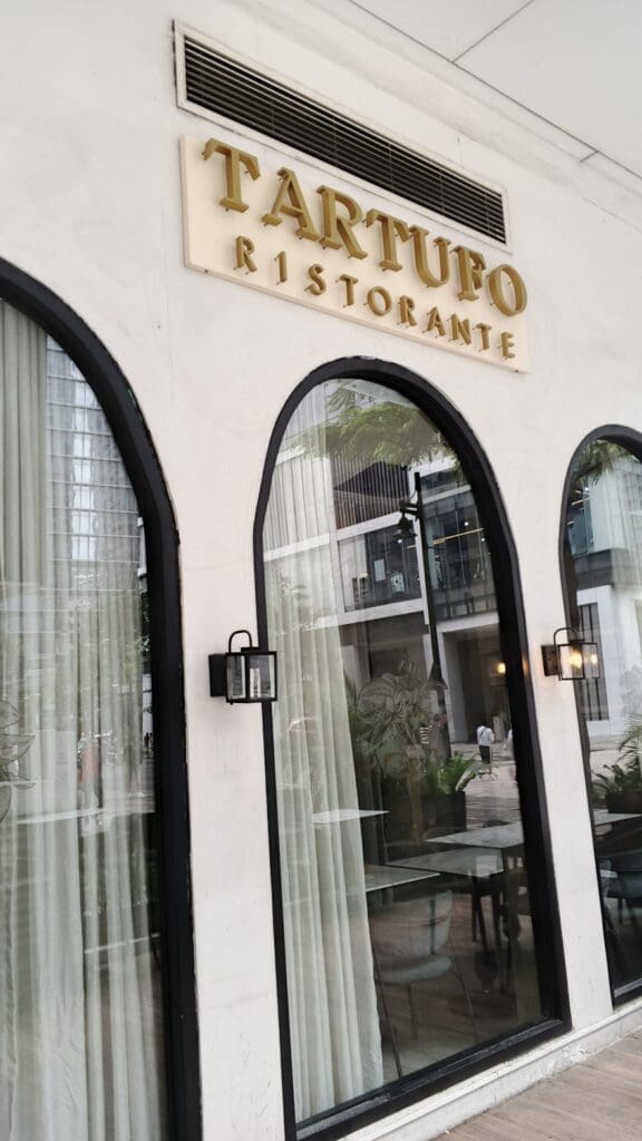 A building with arched windows and outdoor building signage, sign maker Philippines, Metro Manila by M&G Global Ads.