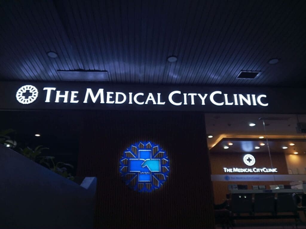Acrylic building signage for THE MEDICAL CITY CLINIC, blue and white logo, Metro Manila, sign maker Philippines by M&G Global Ads.