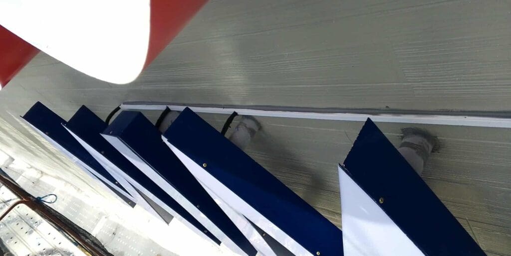 Acrylic building signage with large blue and white letters, wall mounted. Sign maker Philippines. Metro Manila by M&G Global Ads.