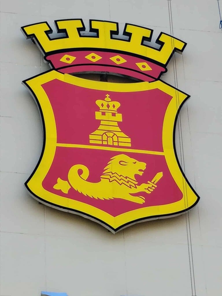 Acrylic emblem signage with red and yellow shield, castle, crowned lion, and gold crown, sign maker Philippines by M&G Global Ads.