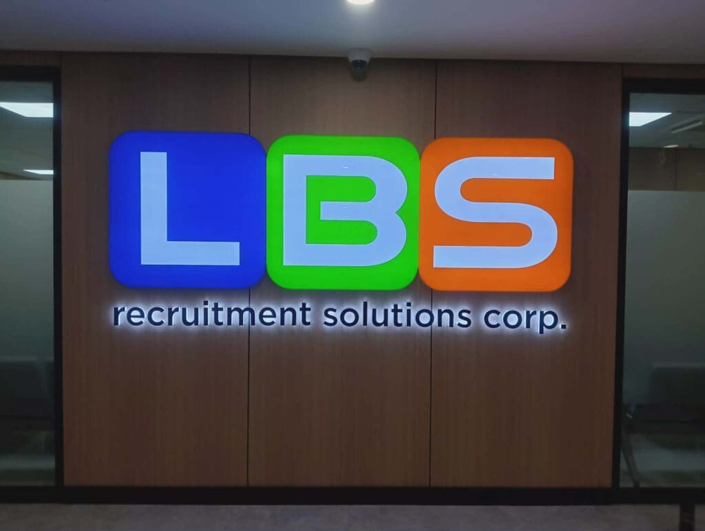 Acrylic illuminated indoor wall sign for LBS Recruitment Solutions Corp, wood background, Metro Manila, sign maker Philippines by M&G Global Ads.