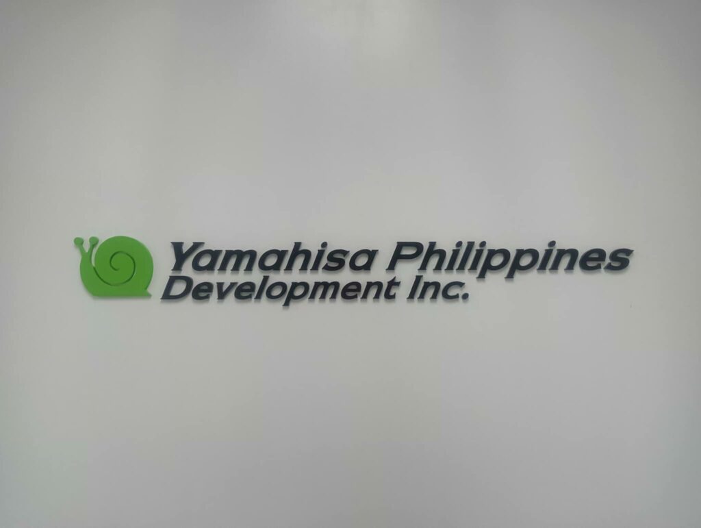 Acrylic indoor wall signage for Yamahisa Philippines Development Inc., green snail logo, sign maker Philippines by M&G Global Ads.