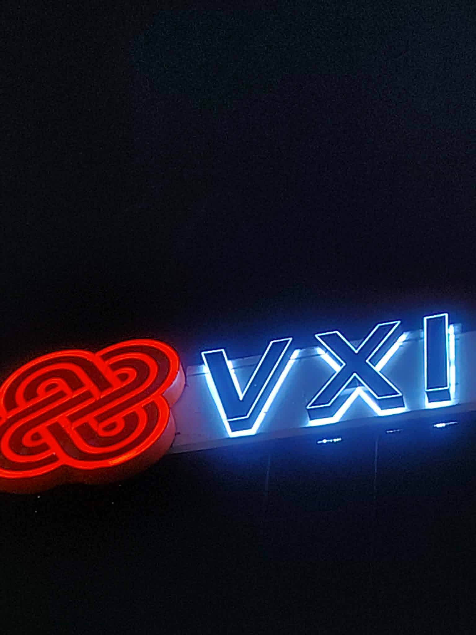 Acrylic LED signage with red abstract logo and blue VXI letters for VXI, Metro Manila, by sign maker Philippines M&G Global Ads.