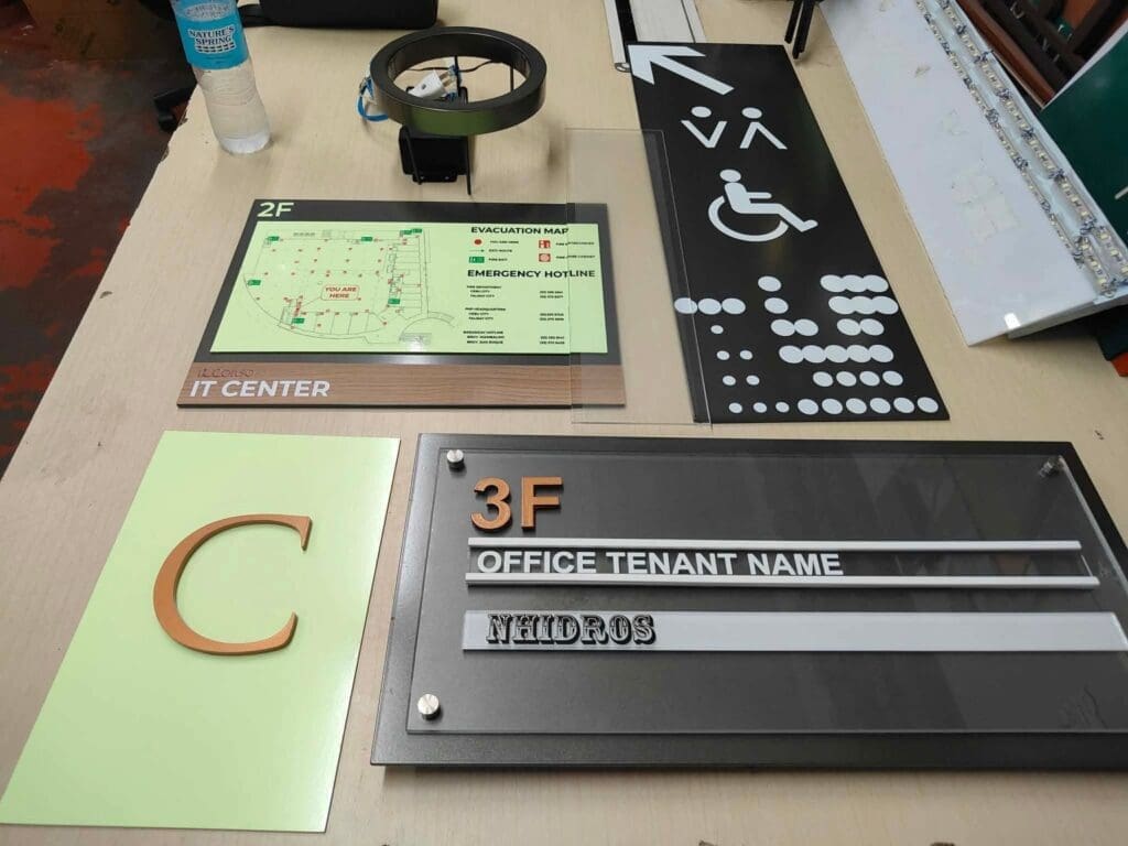 Acrylic office signs, braille accessibility sign, floor directory signage for NHIDOS, Metro Manila by sign maker Philippines M&G Global Ads.