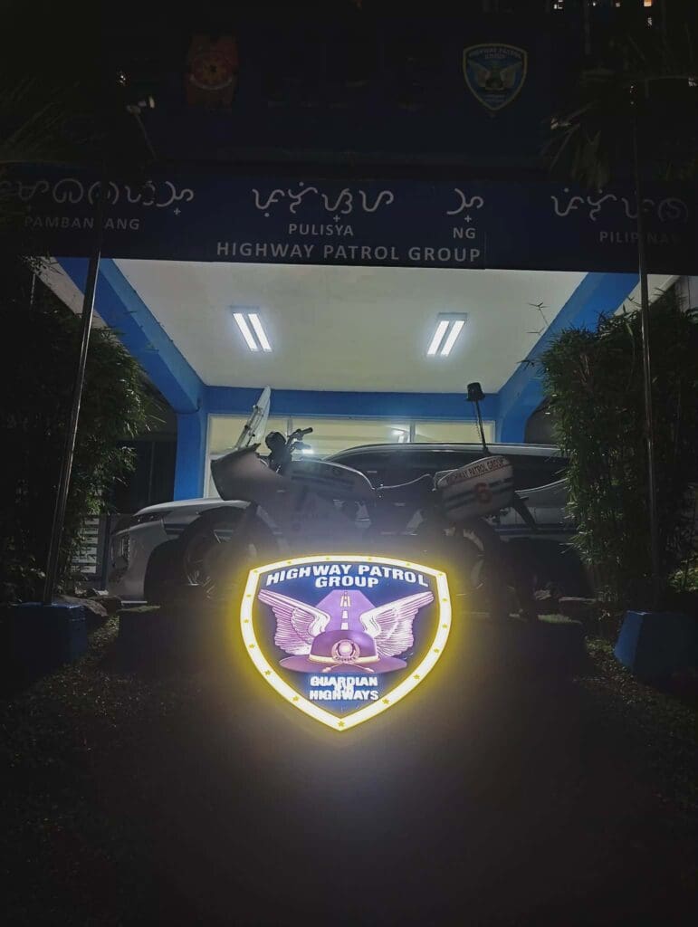 Acrylic outdoor Highway Patrol Group shield signage at Metro Manila station at night, sign maker Philippines by M&G Global Ads.