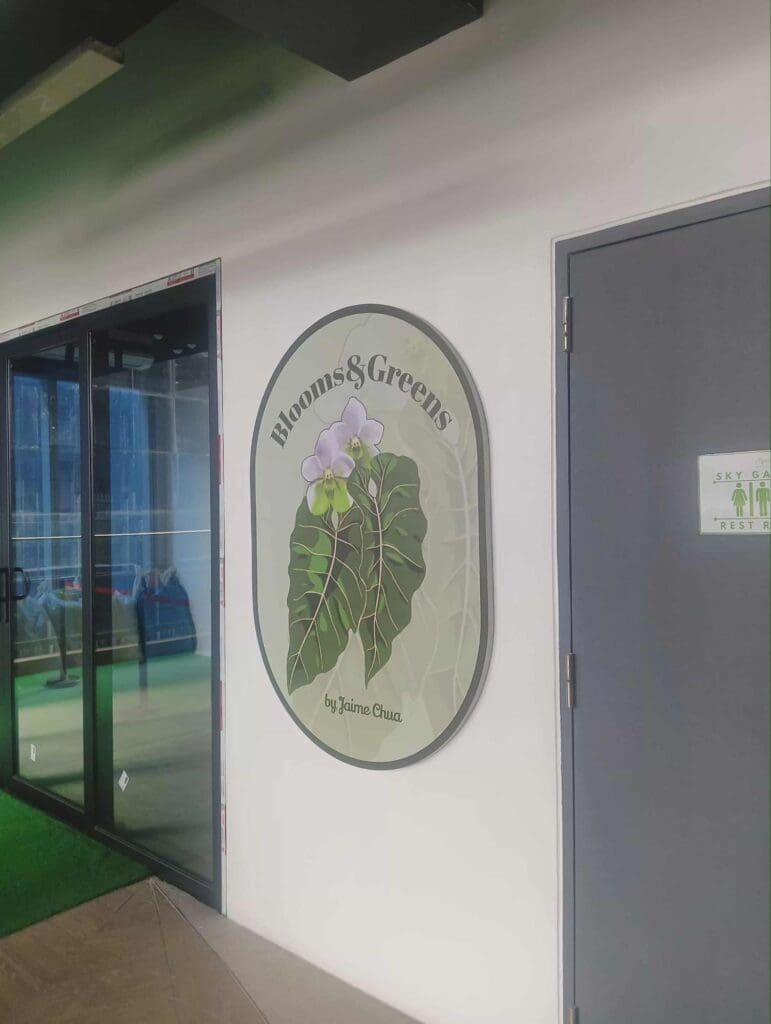 Acrylic wall sign for Blooms & Greens by Jaime Chua, featuring leaves and flowers, Metro Manila, sign maker Philippines by M&G Global Ads.