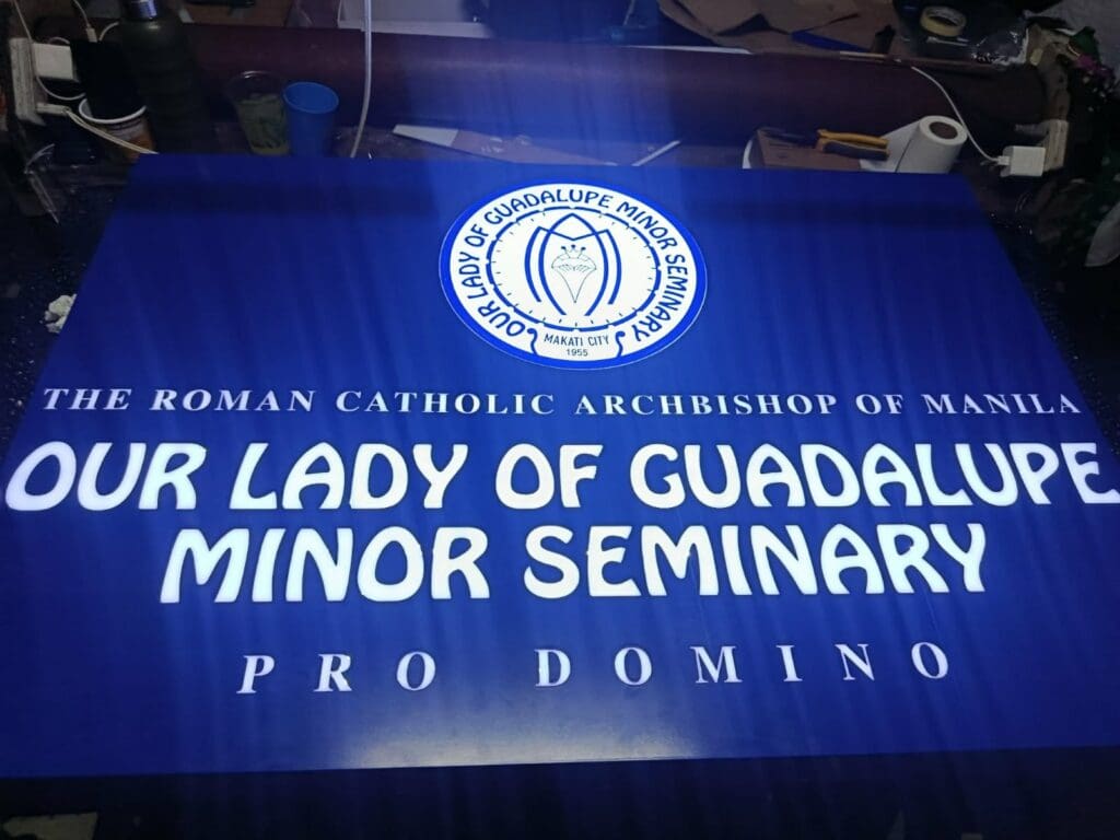 Blue acrylic building sign for Our Lady of Guadalupe Minor Seminary, Metro Manila by sign maker Philippines, M&G Global Ads.