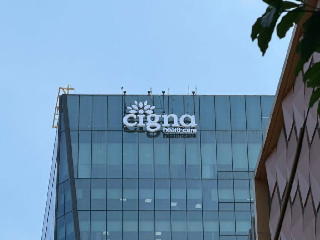 Building signage for Cigna Healthcare in acrylic on glass office facade, Metro Manila, sign maker Philippines by M&G Global Ads.