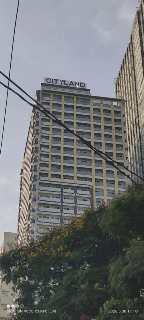 CITYLAND acrylic building signage on a tall structure in Metro Manila, power lines visible—sign maker Philippines by M&G Global Ads.