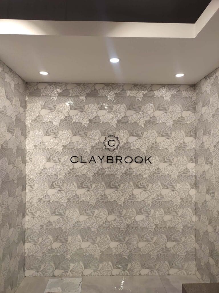 Indoor acrylic building signage for CLAYBROOK with logo on tiled leaf-pattern wall, Metro Manila, sign maker Philippines by M&G Global Ads.