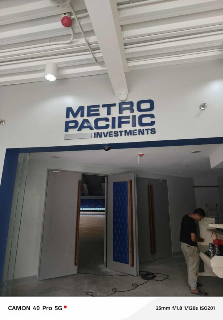 Indoor acrylic building signage for METRO PACIFIC INVESTMENTS, Metro Manila, sign maker Philippines by M&G Global Ads.