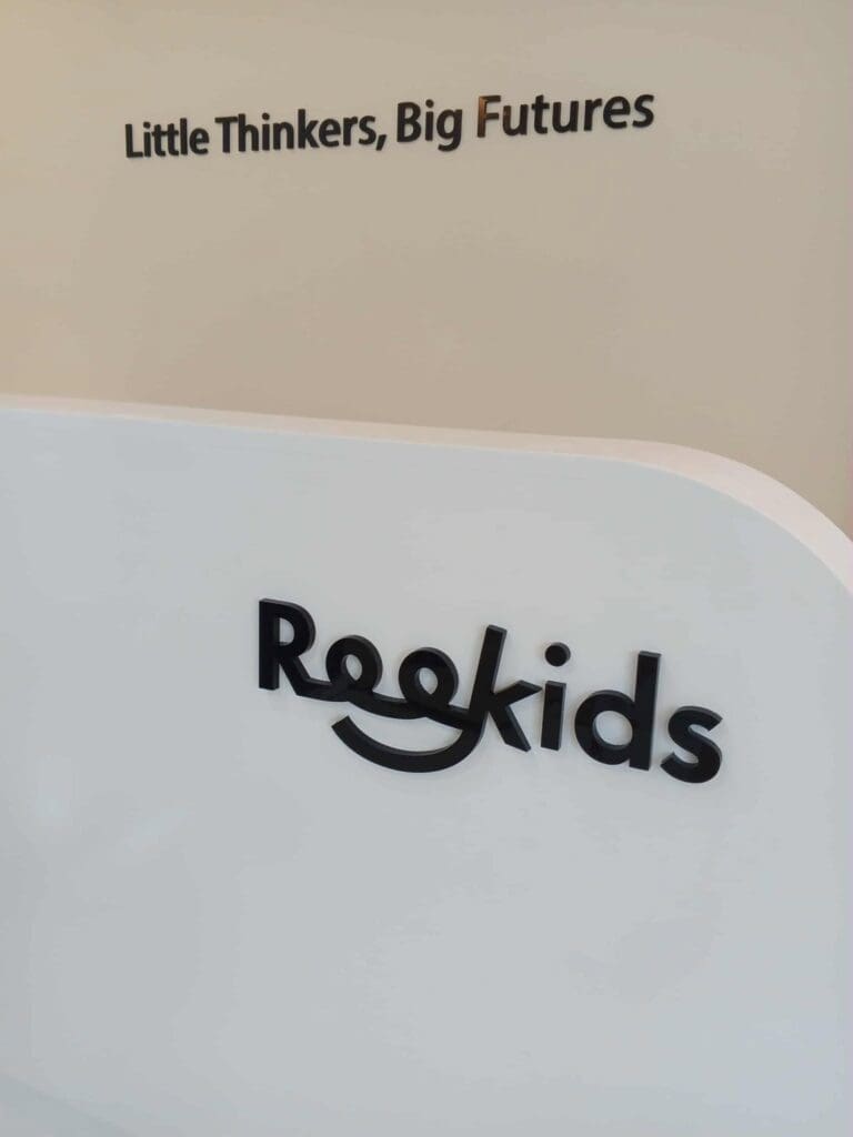 Indoor acrylic reception signage for Rookids, with motivational text above. Sign maker Philippines by M&G Global Ads. Metro Manila.
