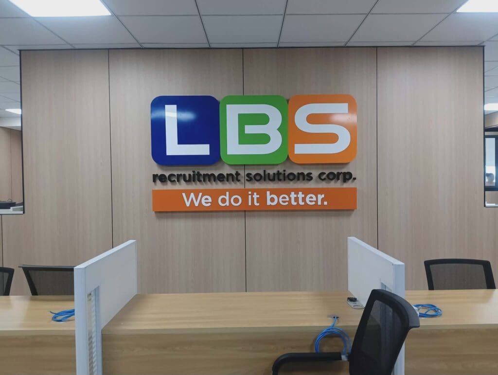 Indoor acrylic signage for LBS Recruitment Solutions Corp in a modern office, Metro Manila, sign maker Philippines by M&G Global Ads.