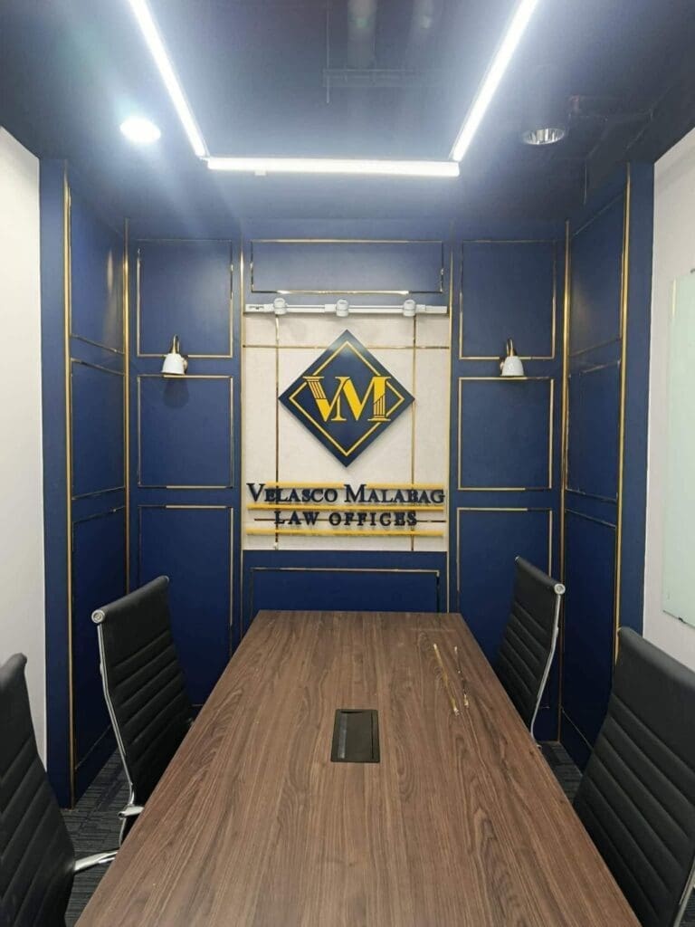 Indoor acrylic signage for Velasco Malabag Law Offices, blue accent wall, Metro Manila, sign maker Philippines by M&G Global Ads.