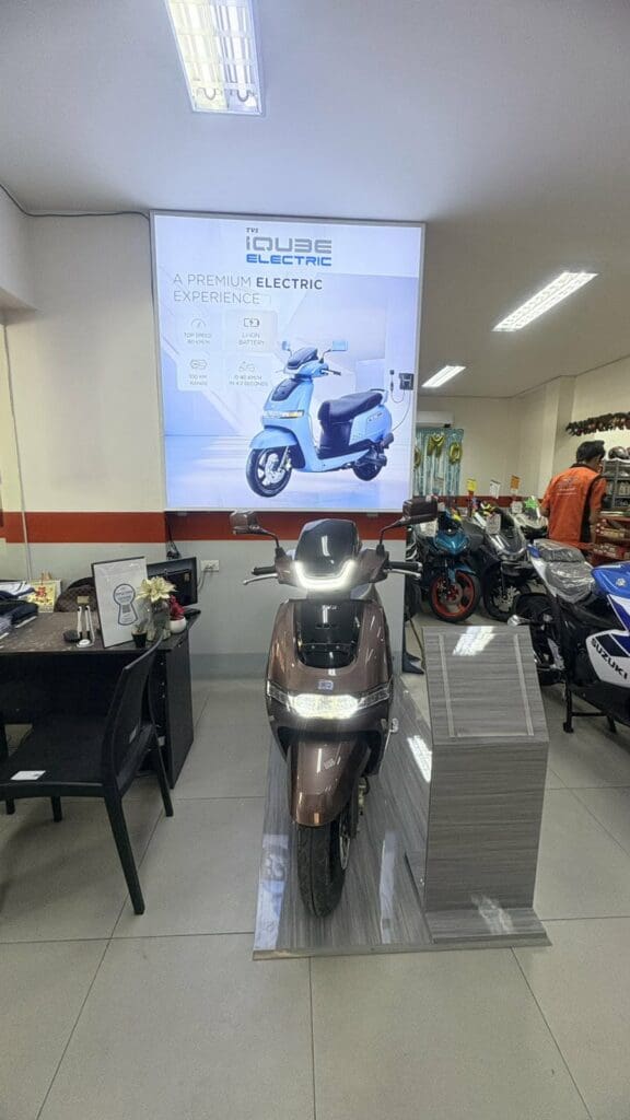 Indoor digital poster signage with PURE ELECTRIC branding at scooter showroom, Metro Manila. Sign maker Philippines by M&G Global Ads.