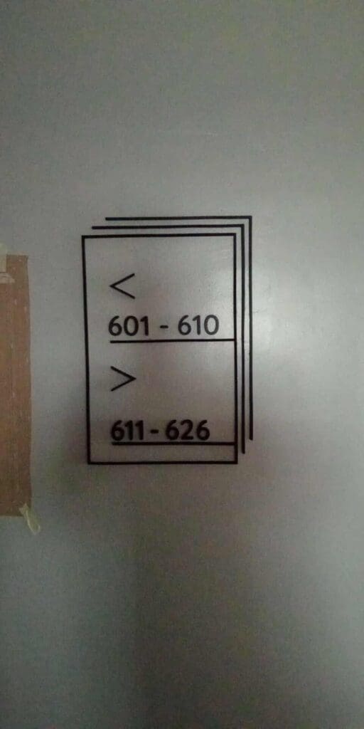 Indoor wayfinding signage with directional arrows (601-610 up, 611-626 down), Metro Manila, sign maker Philippines by M&G Global Ads.