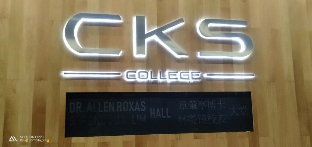 LED acrylic building signage CKS COLLEGE Metro Manila sign maker Philippines, wood wall background by M&G Global Ads.