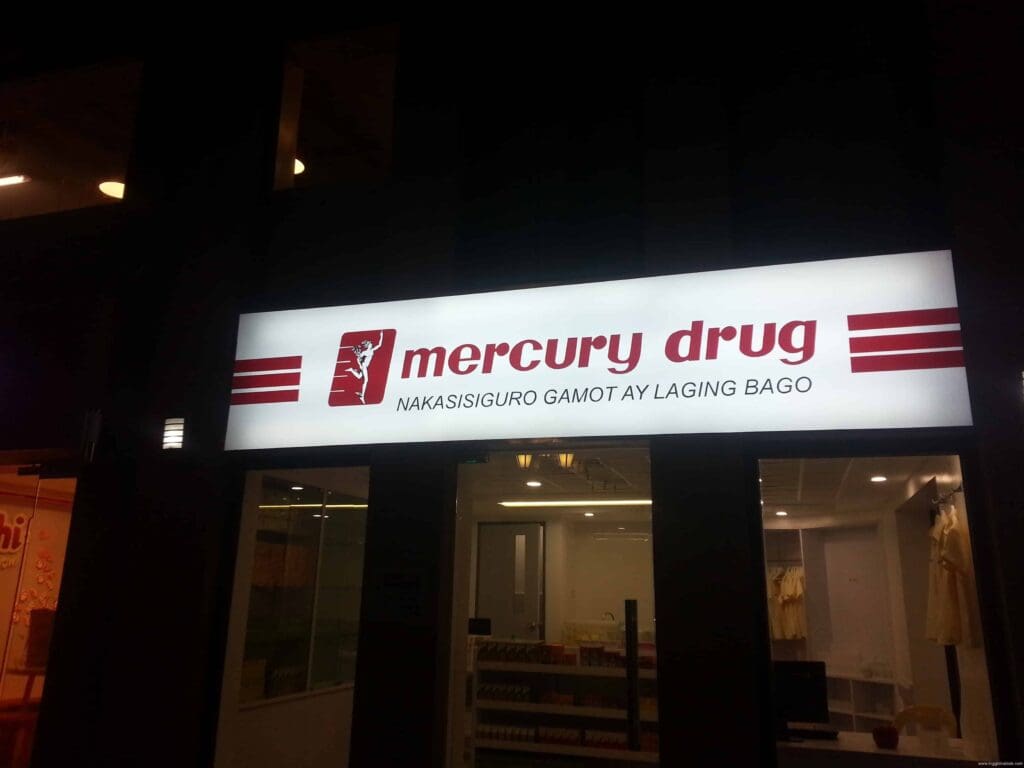 Mercury Drug acrylic LED building signage with red logo and slogan at night, Metro Manila, sign maker Philippines by M&G Global Ads.