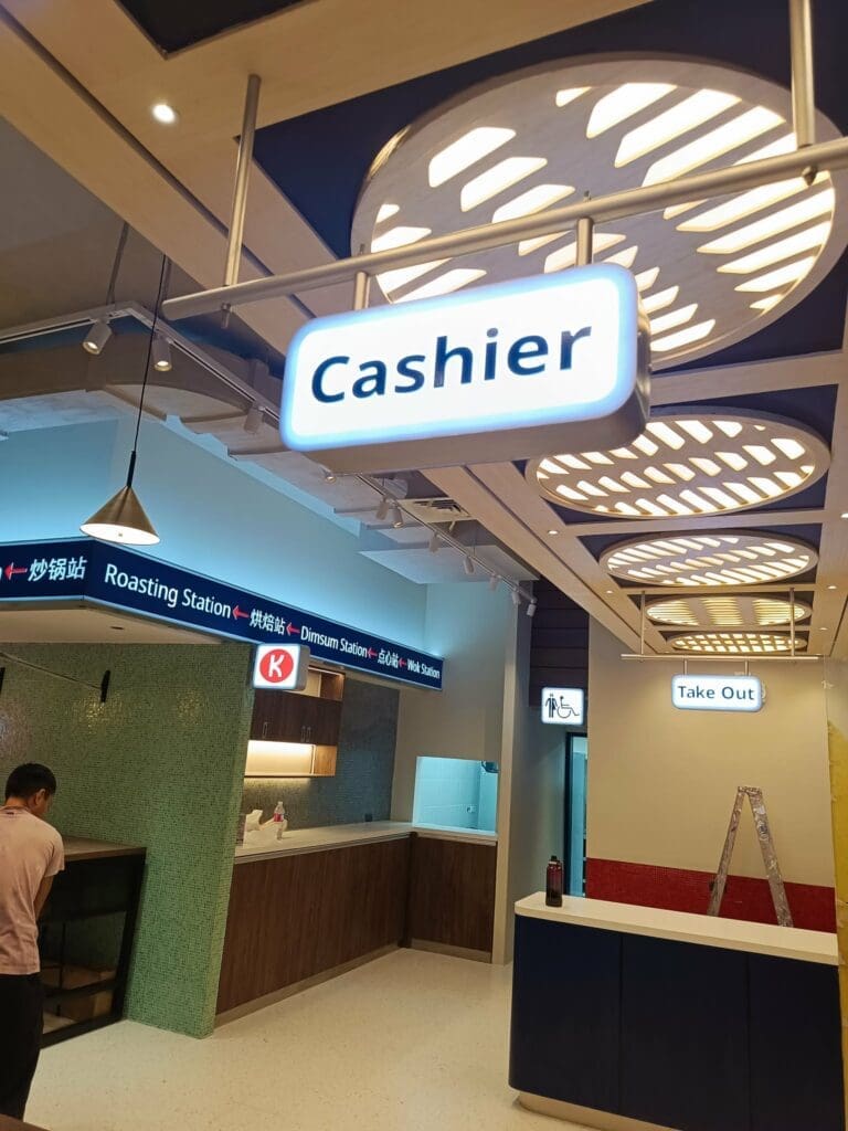 Modern restaurant in Metro Manila with indoor LED acrylic wayfinding signs for Cashier, Roasting, Dimsum, Take Out by sign maker Philippines M&G Global Ads.