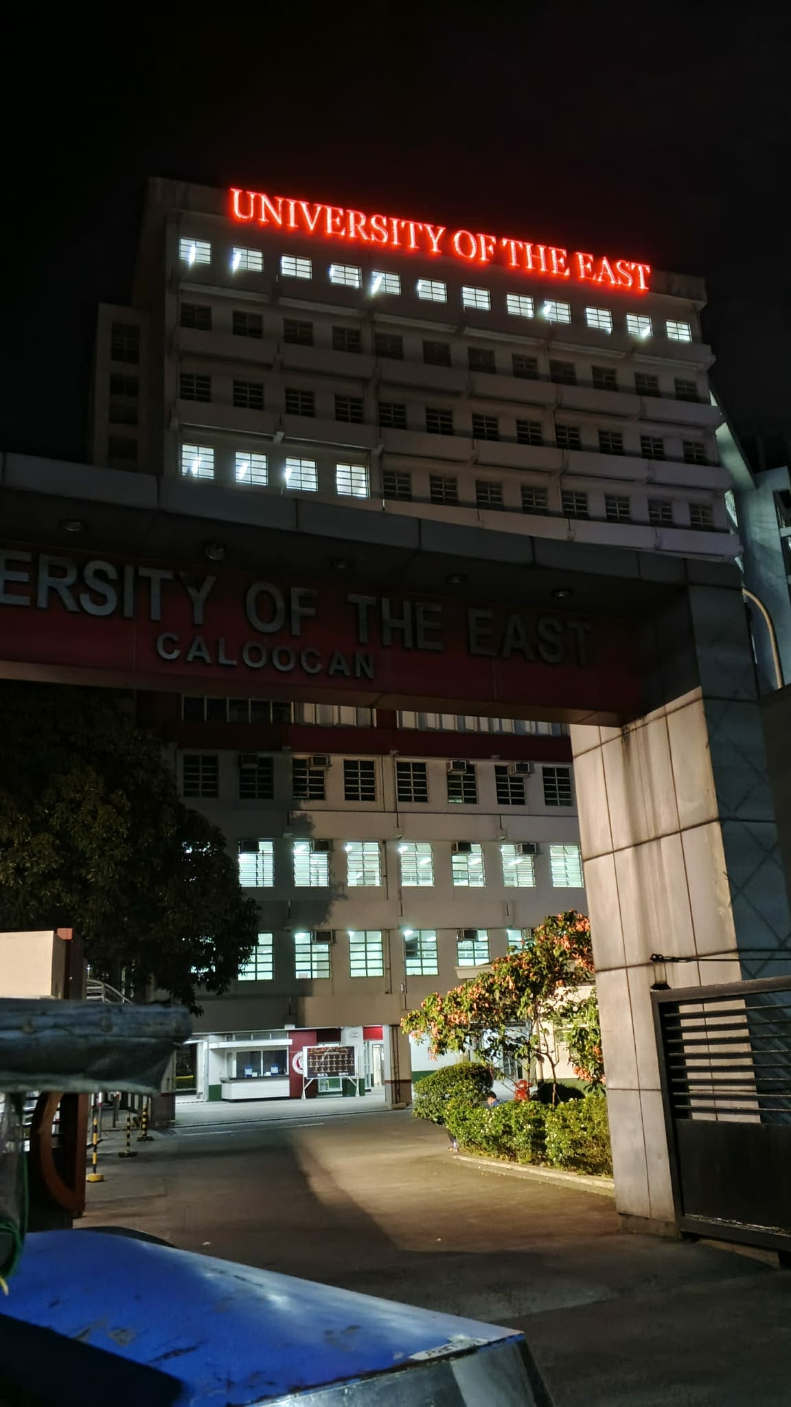 Night view, UE Caloocan, red LED building signage for UNIVERSITY OF THE EAST. Sign maker Philippines by M&G Global Ads.